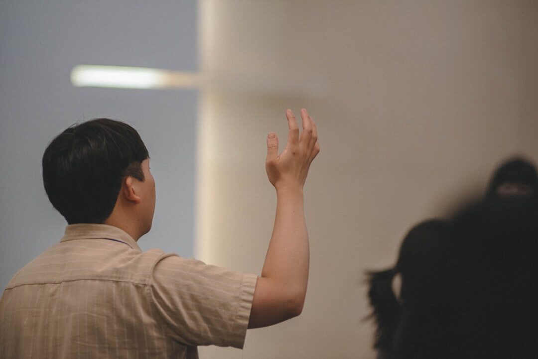 person gesturing during talk