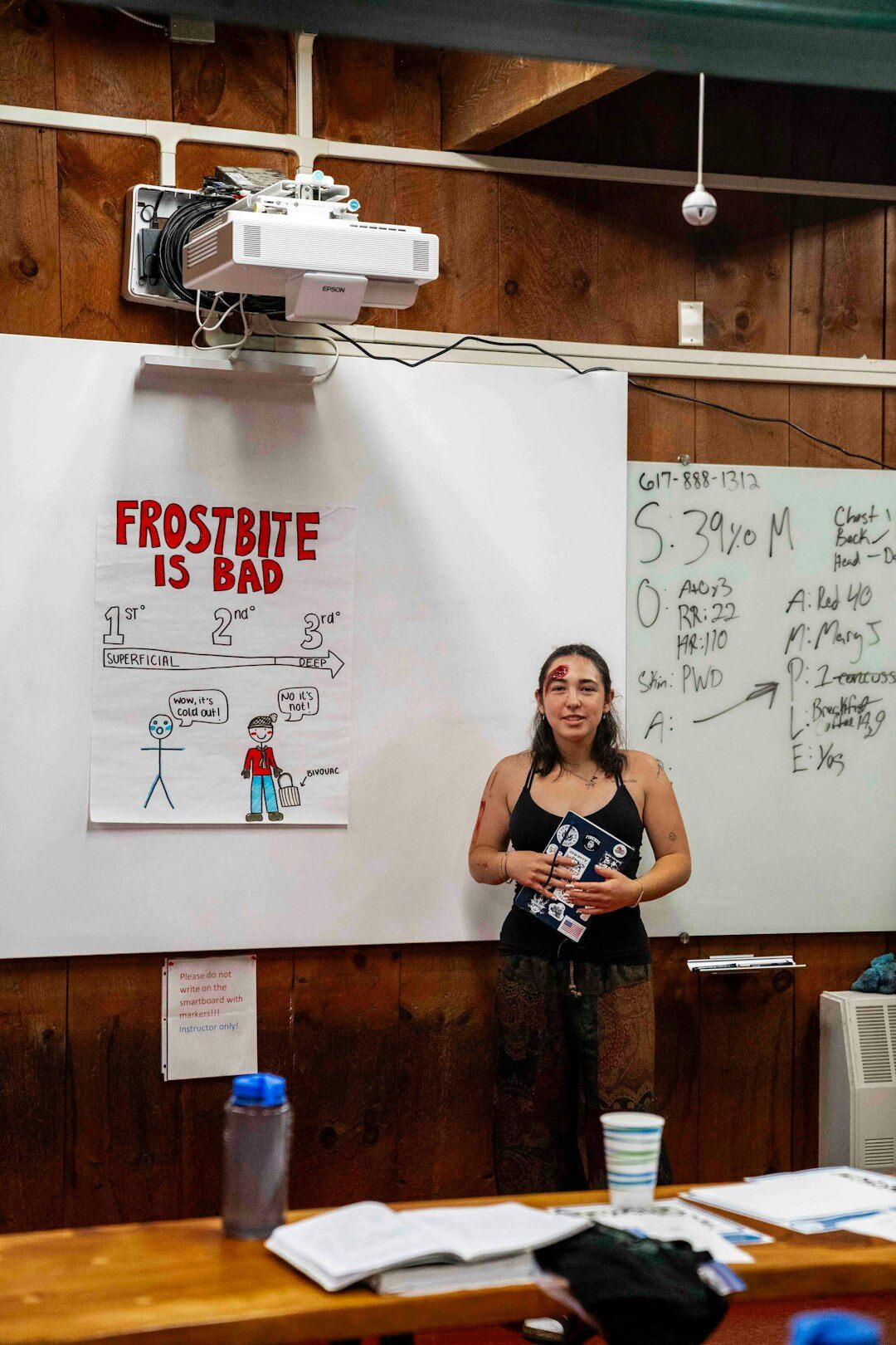 Woman practicing a presentation in front of a small audience