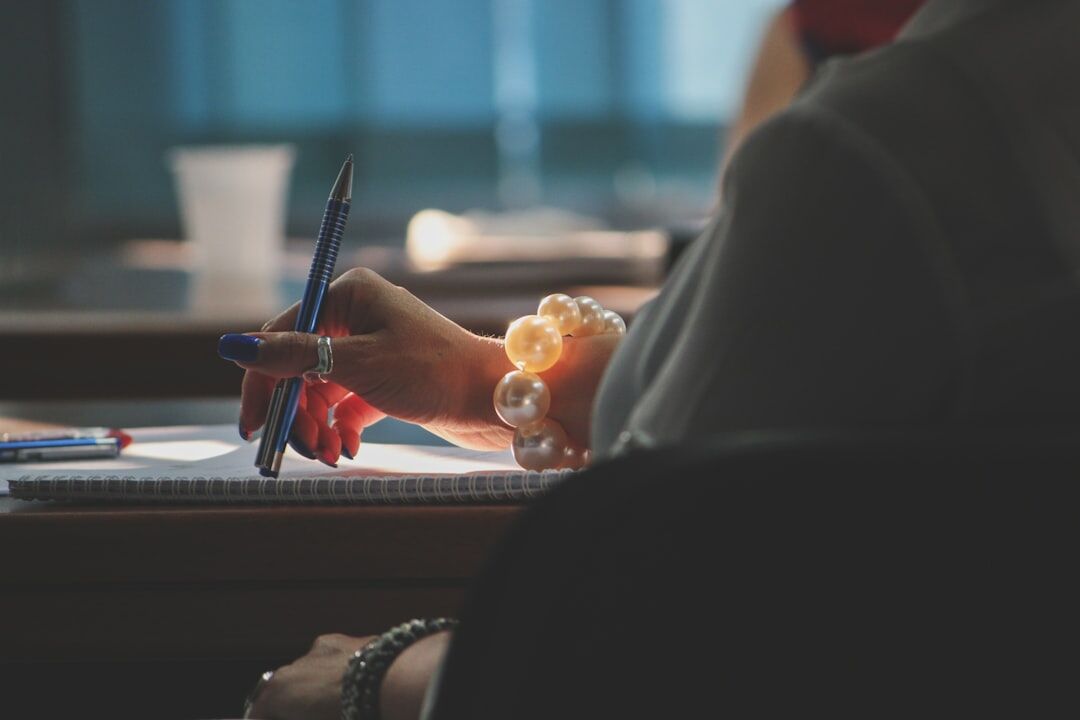 person taking notes in workshop