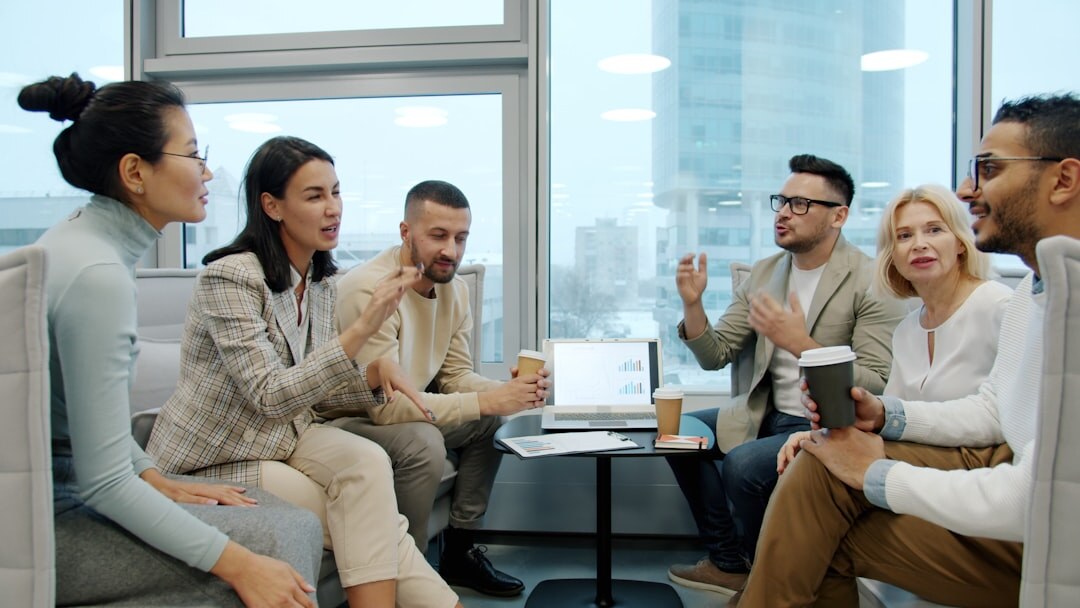 Diverse group of people talking in a circle during a communication workshop